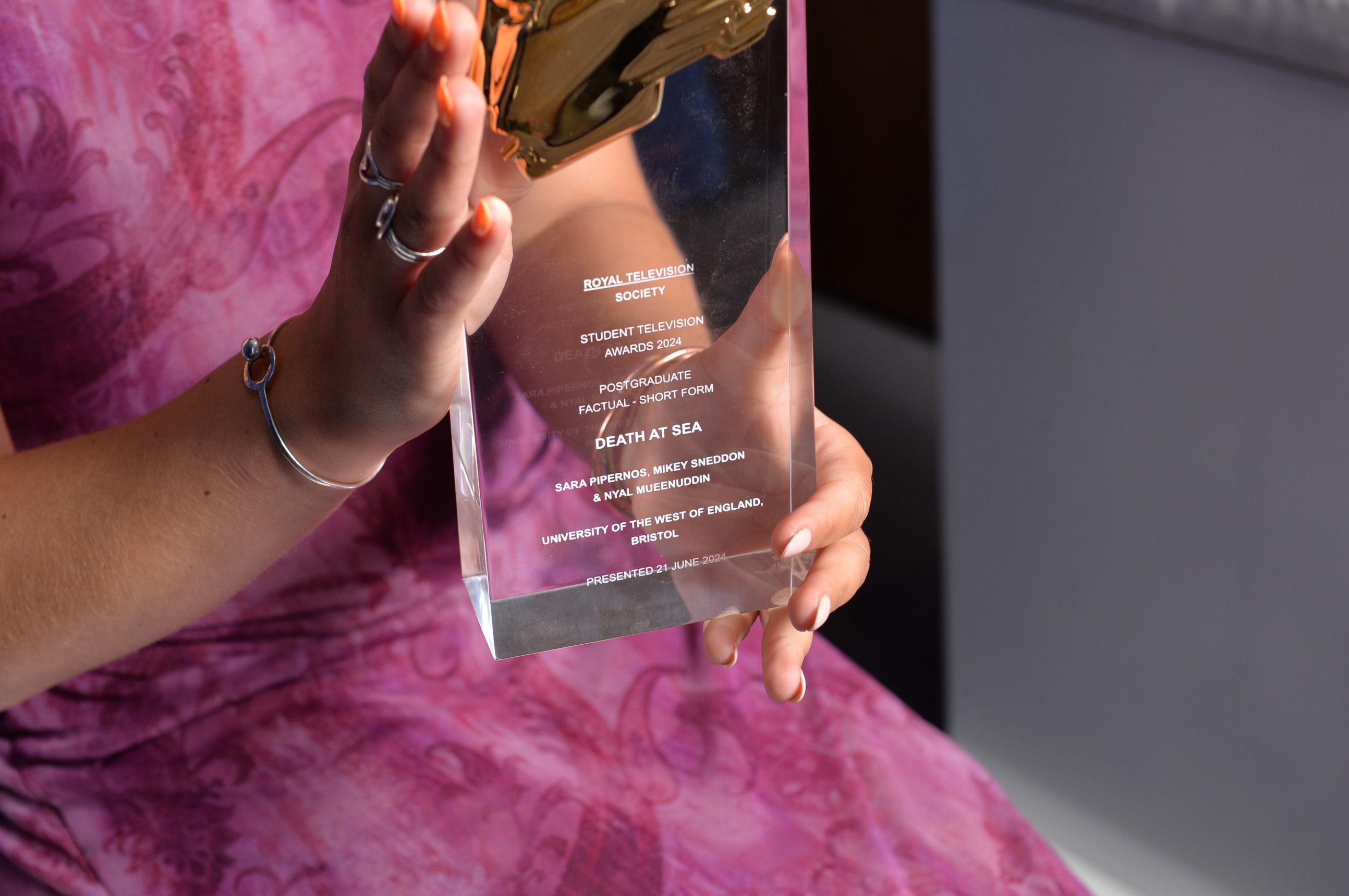 Woman holding award