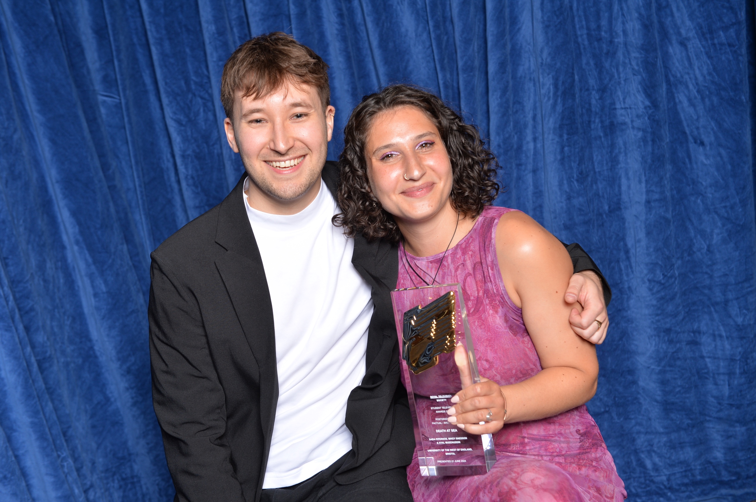 Two people holding award